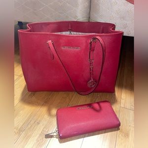 Red michael kors brand bag, big enough for anything..